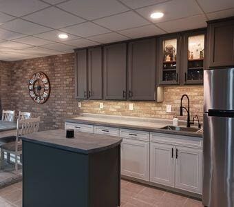 935 Stony Lake Ct, Oxford, MI 48371 - bar featuring backsplash, freestanding refrigerator, a drop ceiling, and a sink