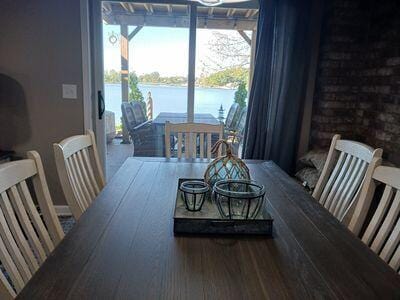 935 Stony Lake Ct, Oxford, MI 48371 - dining room with wood finished floors and a water view