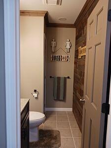 935 Stony Lake Ct, Oxford, MI 48371 - bathroom featuring tile patterned flooring, visible vents, toilet, vanity, and crown molding