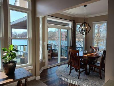 935 Stony Lake Ct, Oxford, MI 48371 - dining room with baseboards, a notable chandelier, ornamental molding, and dark wood finished floors