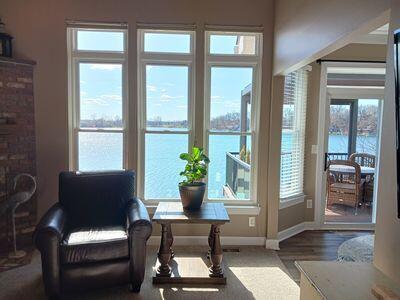 935 Stony Lake Ct, Oxford, MI 48371 - doorway to outside featuring baseboards, wood finished floors, and a water view