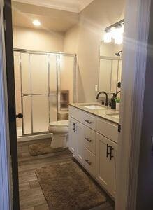 935 Stony Lake Ct, Oxford, MI 48371 - full bath featuring toilet, vanity, and a stall shower