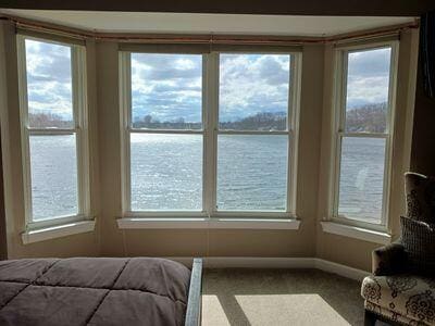 935 Stony Lake Ct, Oxford, MI 48371 - unfurnished bedroom featuring carpet, a water view, and baseboards