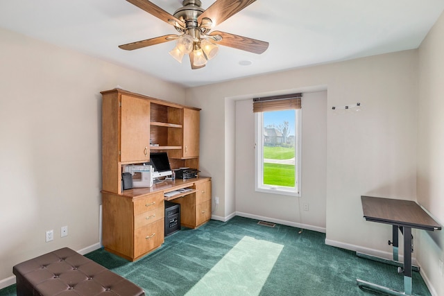 office space with ceiling fan, visible vents, baseboards, and dark carpet