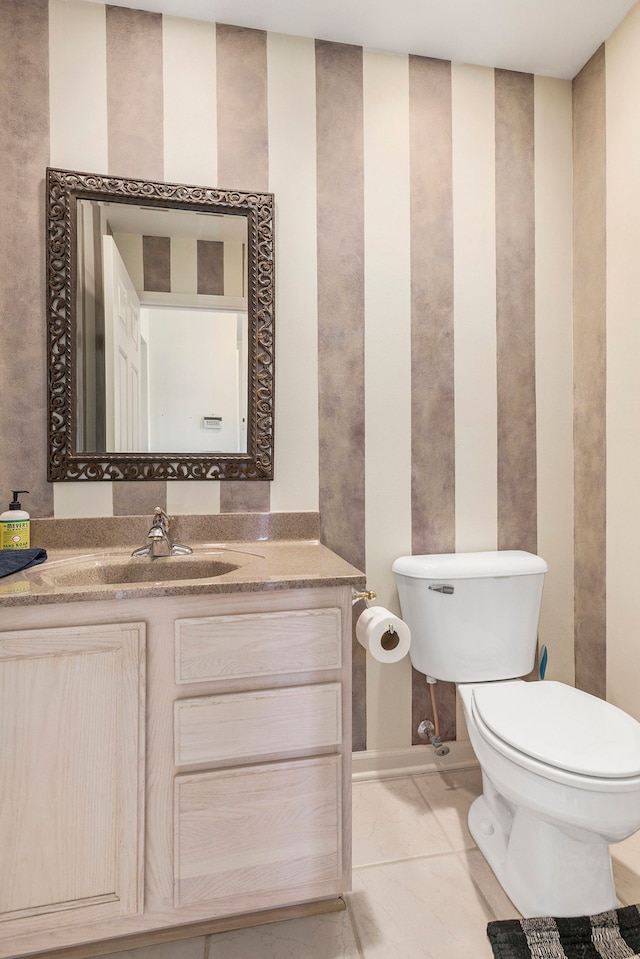 bathroom with toilet and vanity