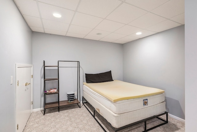 bedroom with carpet floors, recessed lighting, baseboards, and a drop ceiling