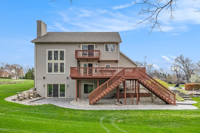 back of property with stairs, a deck, a chimney, a balcony, and a yard
