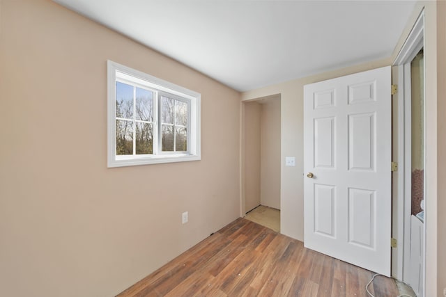 unfurnished bedroom featuring wood finished floors