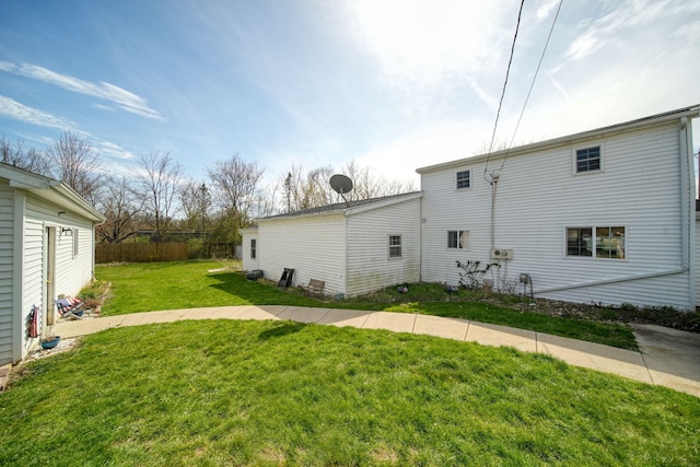 view of side of home featuring a lawn