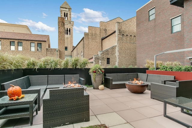 27 Library St NE Unit 601, Grand Rapids, MI 49503 - view of patio / terrace featuring an outdoor living space with a fire pit