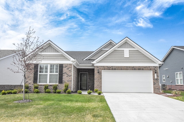 4336 Silica Dr, Lake Orion, MI 48359 - craftsman-style house with driveway, a front yard, brick siding, and a garage