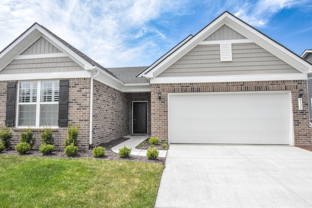 4336 Silica Dr, Lake Orion, MI 48359 - view of front facade with a front yard, concrete driveway, brick siding, and an attached garage