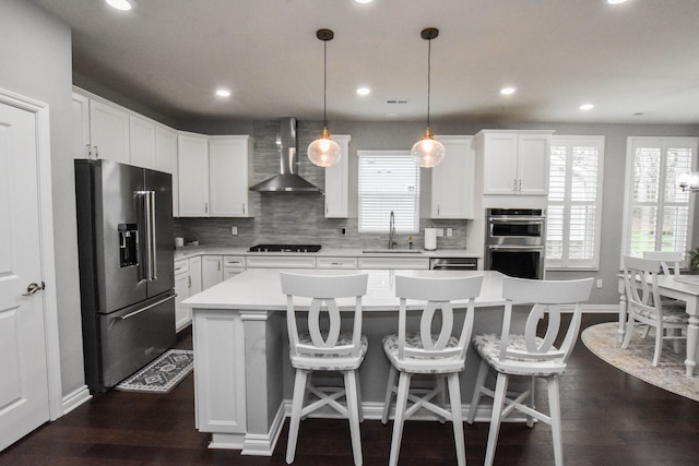 4336 Silica Dr, Lake Orion, MI 48359 - kitchen featuring tasteful backsplash, a sink, stainless steel appliances, light countertops, and wall chimney exhaust hood