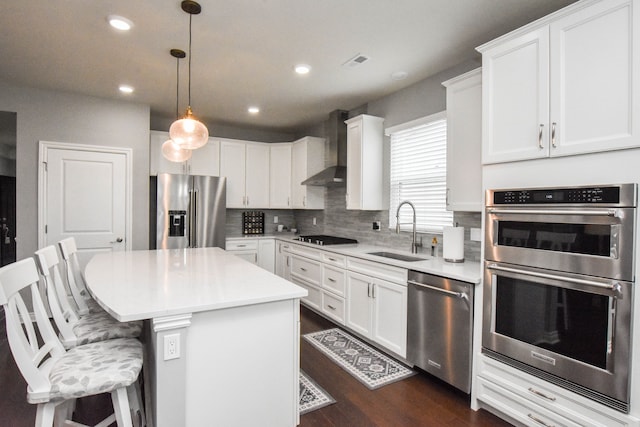 4336 Silica Dr, Lake Orion, MI 48359 - kitchen with a sink, stainless steel appliances, dark wood-style floors, a center island, and wall chimney exhaust hood
