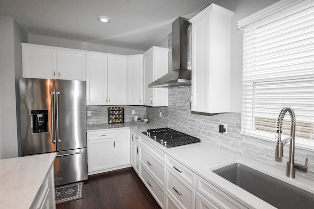 4336 Silica Dr, Lake Orion, MI 48359 - kitchen with backsplash, a sink, appliances with stainless steel finishes, and wall chimney range hood
