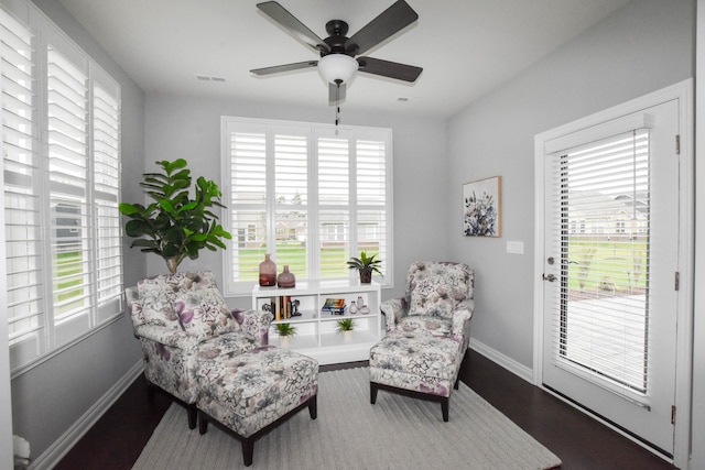 4336 Silica Dr, Lake Orion, MI 48359 - living area featuring baseboards, visible vents, a ceiling fan, and a healthy amount of sunlight