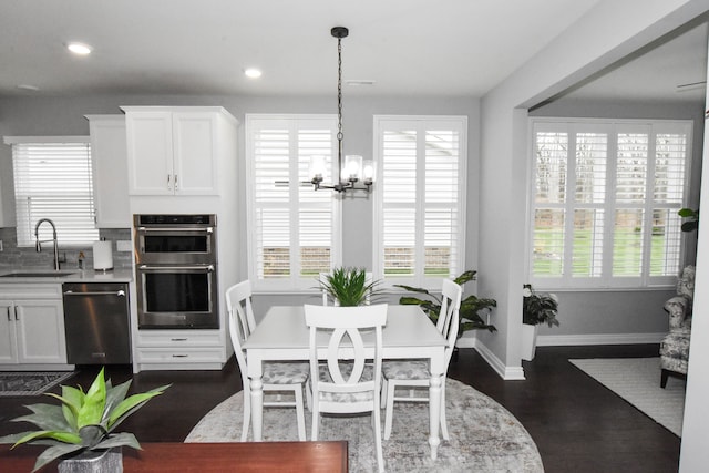 4336 Silica Dr, Lake Orion, MI 48359 - dining area featuring baseboards, recessed lighting, a notable chandelier, and dark wood-style flooring