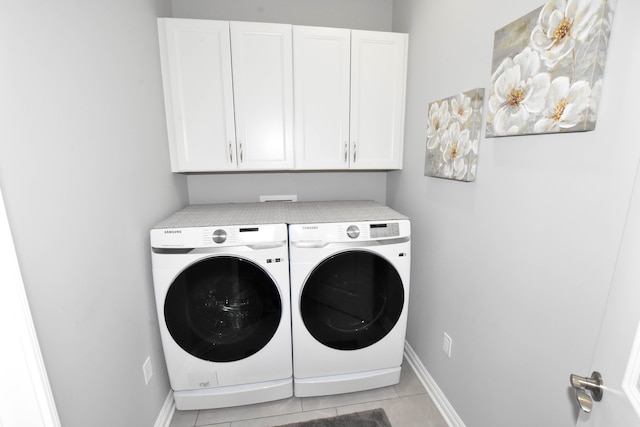 4336 Silica Dr, Lake Orion, MI 48359 - washroom with light tile patterned floors, washer and dryer, cabinet space, and baseboards