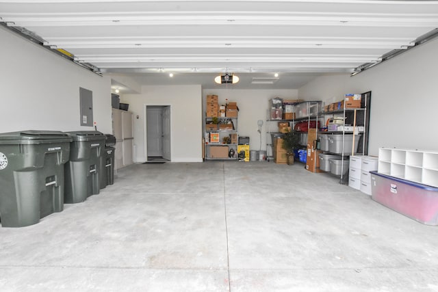 4336 Silica Dr, Lake Orion, MI 48359 - garage featuring a garage door opener and electric panel