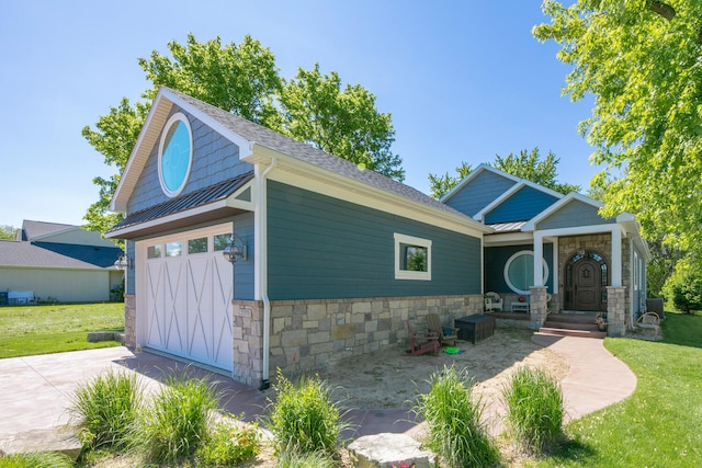 21373 Sail Bay Dr, Cassopolis, MI 49031 - craftsman-style home with stone siding, a front lawn, and a garage