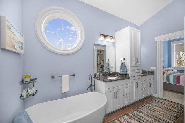 21373 Sail Bay Dr, Cassopolis, MI 49031 - full bathroom with ensuite bath, a soaking tub, double vanity, and lofted ceiling