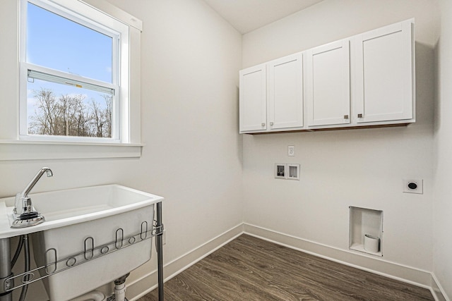 laundry area with hookup for a washing machine, hookup for an electric dryer, cabinet space, baseboards, and dark wood-type flooring