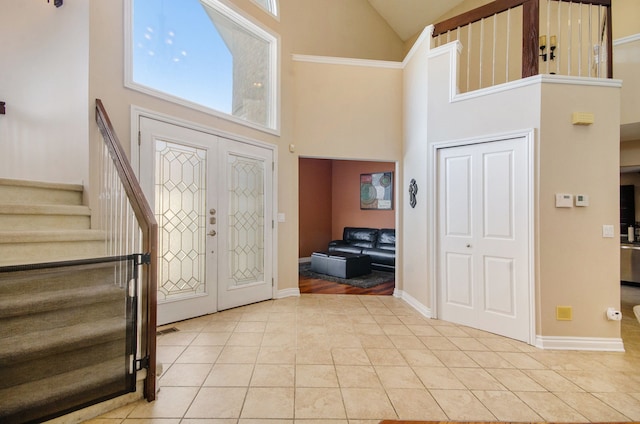 28909 Hidden Trl, Farmington Hills, MI 48331 - entryway featuring high vaulted ceiling, stairs, light tile patterned flooring, french doors, and baseboards