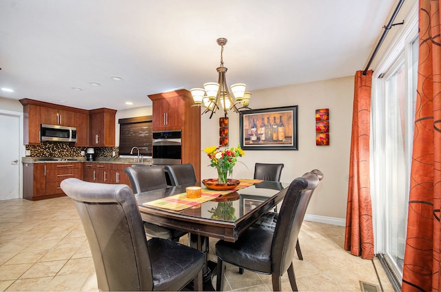 28909 Hidden Trl, Farmington Hills, MI 48331 - dining area featuring a chandelier, light tile patterned floors, recessed lighting, and baseboards