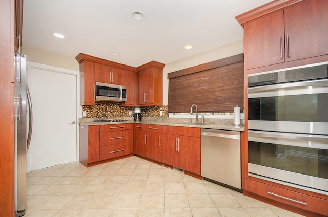 28909 Hidden Trl, Farmington Hills, MI 48331 - kitchen featuring appliances with stainless steel finishes, a sink, tasteful backsplash, light stone countertops, and recessed lighting