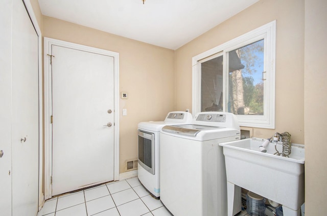 28909 Hidden Trl, Farmington Hills, MI 48331 - washroom featuring washer and dryer and light tile patterned floors