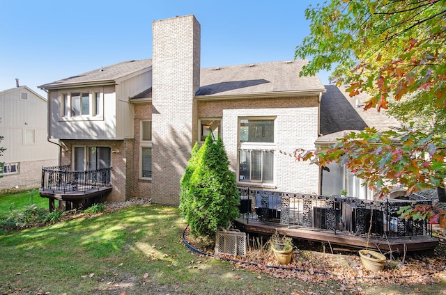 28909 Hidden Trl, Farmington Hills, MI 48331 - back of property with a chimney, brick siding, a wooden deck, a lawn, and a shingled roof