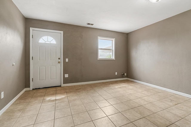 entrance foyer with plenty of natural light, visible vents, and baseboards