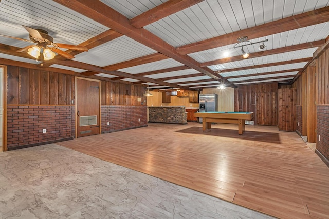 rec room featuring beamed ceiling, wooden walls, pool table, and ceiling fan
