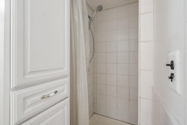 bathroom with a shower stall