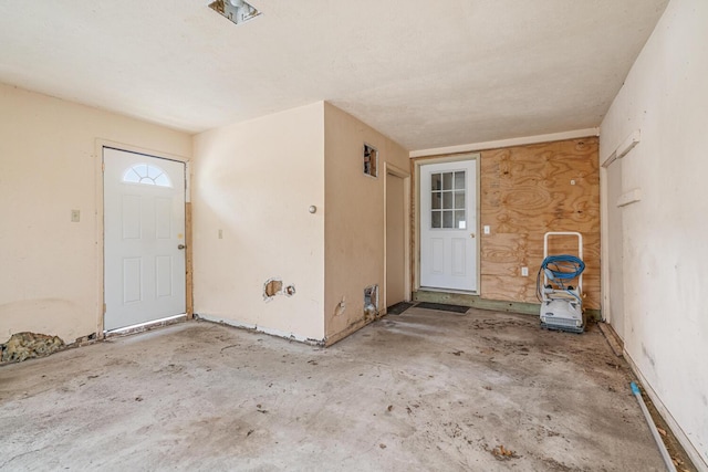 property entrance featuring a patio area