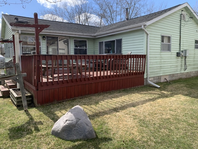 1026 Lakeview Dr, Brooklyn, MI 49230 - rear view of house with a wooden deck, roof with shingles, and a yard