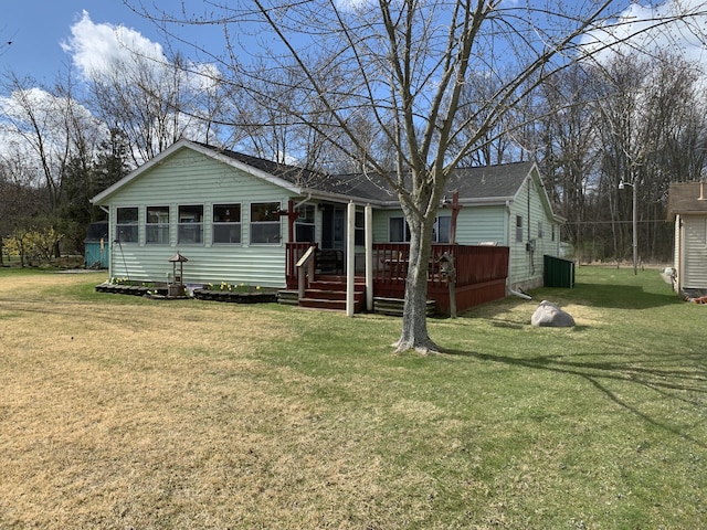 1026 Lakeview Dr, Brooklyn, MI 49230 - ranch-style home with a wooden deck and a front yard