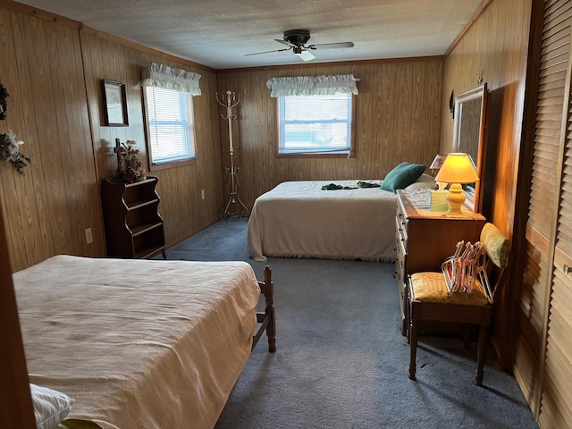 1026 Lakeview Dr, Brooklyn, MI 49230 - bedroom featuring carpet, wood walls, a ceiling fan, crown molding, and a textured ceiling