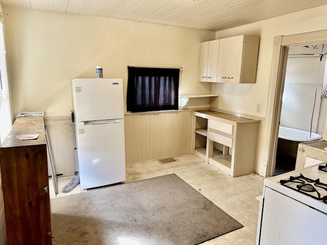 kitchen with wood ceiling and white appliances