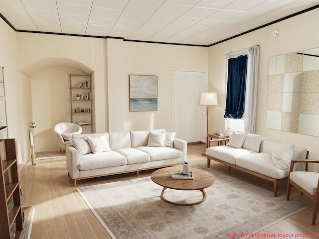 living room featuring wood finished floors and crown molding