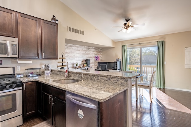 1242 Bay, Holly, MI 48442 - kitchen featuring ceiling fan, visible vents, vaulted ceiling, a sink, and stainless steel appliances
