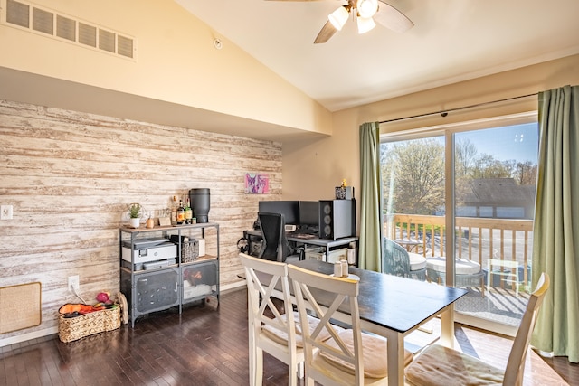 1242 Bay, Holly, MI 48442 - dining area with visible vents, wood walls, dark wood-style floors, a ceiling fan, and vaulted ceiling