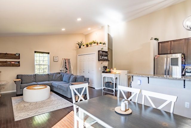 1242 Bay, Holly, MI 48442 - living area with recessed lighting, baseboards, lofted ceiling, and dark wood-type flooring