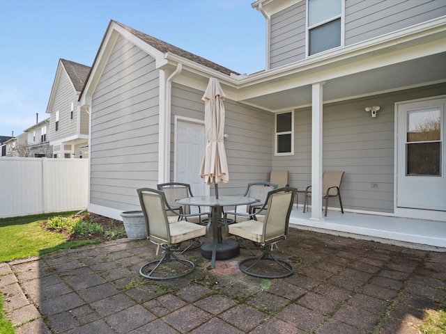 view of patio / terrace with outdoor dining space and fence