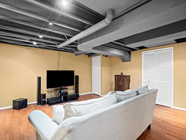 living room with wood finished floors and baseboards