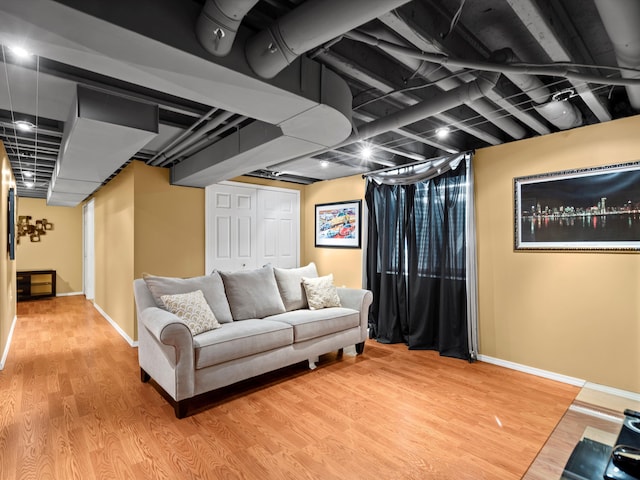 living room featuring light wood-style flooring and baseboards
