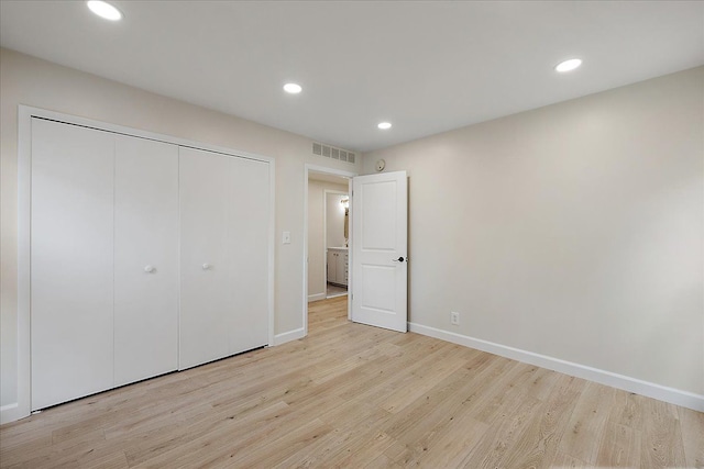 unfurnished bedroom with visible vents, light wood-type flooring, recessed lighting, and baseboards