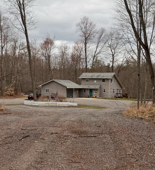 view of front of home with aphalt driveway