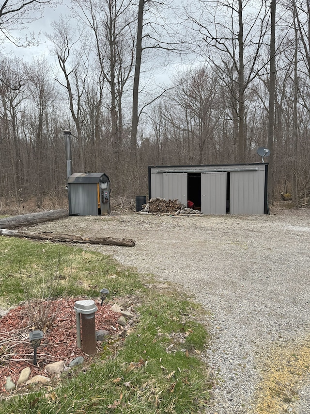 view of yard with an outbuilding and a pole building