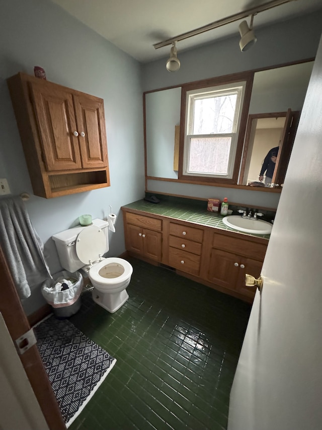 bathroom with vanity and toilet